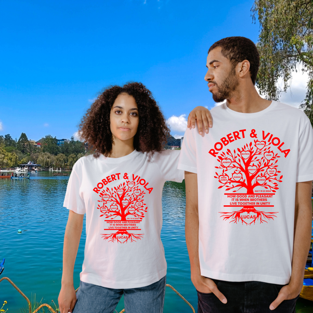 A couple , man and woman sporting white t-shirt with red print standing in front of a lake