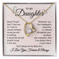 a gift displaying a heartfelt message, The message card reads: Never forget that I love you. If I had to choose between loving and breathing, I would use my last breath to say I love you. Whenever you feel inadequate, unworthy, or unloved, straighten your necklace and remember that I am always there in your heart. You'll always be my bay girl. I love you, forever & always.