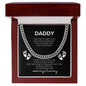 a message card that reads Daddy I can't wait to meet you! I may be just a bump, but I love you already more than you'll ever know. you're doing a great job. you're my hero already. keep this close to your heart until I can cuddle up WITH you. love and Kicks from, Mommy's Tummy including a STAINLESS Cuban link chain and baby feet in a MAGHONY LUXURY gift box.